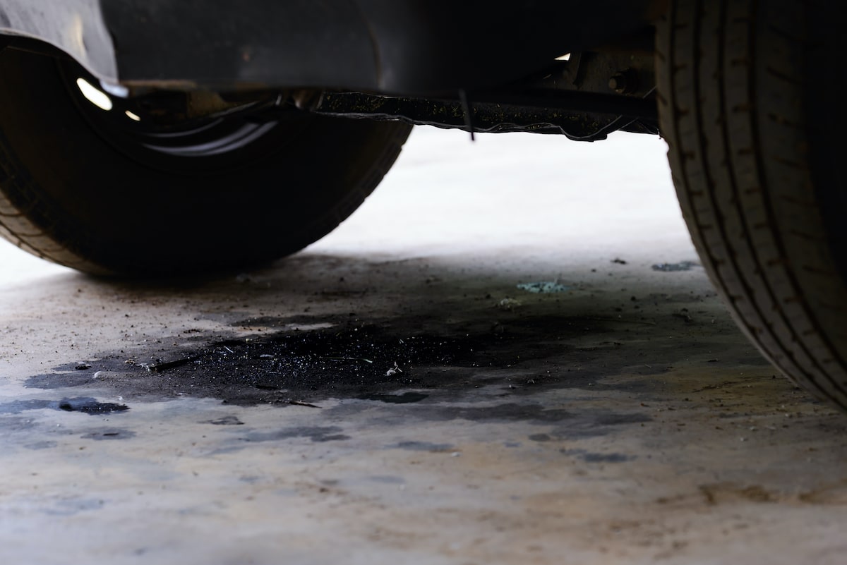 leaking fluids underneath a car a warning sign for repair