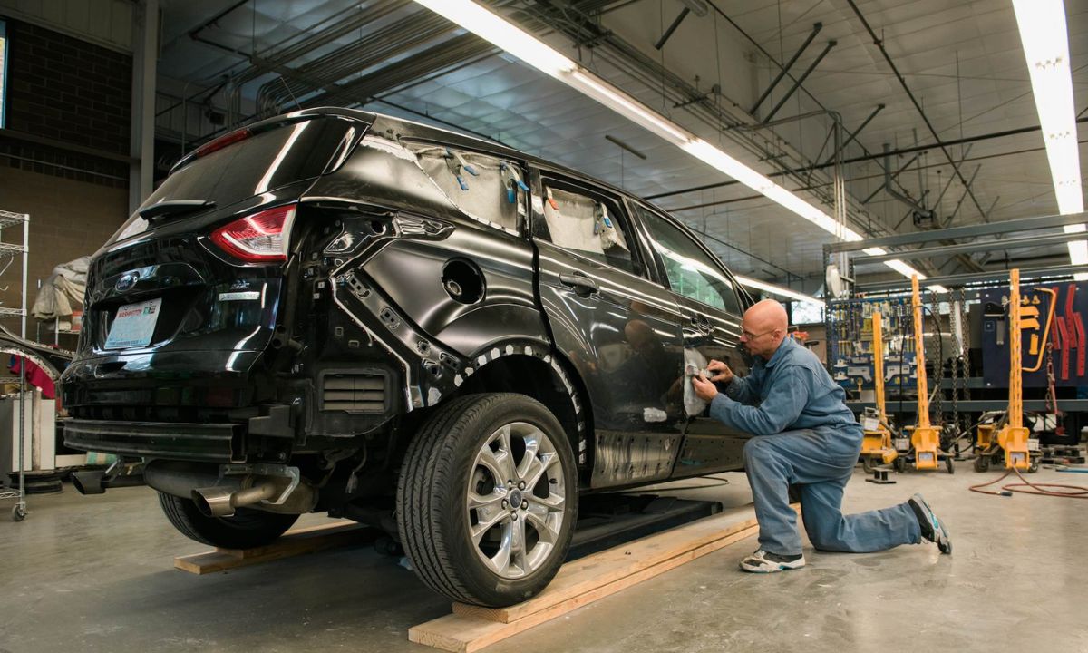 Mackins - mackins mechanic working on vehicle