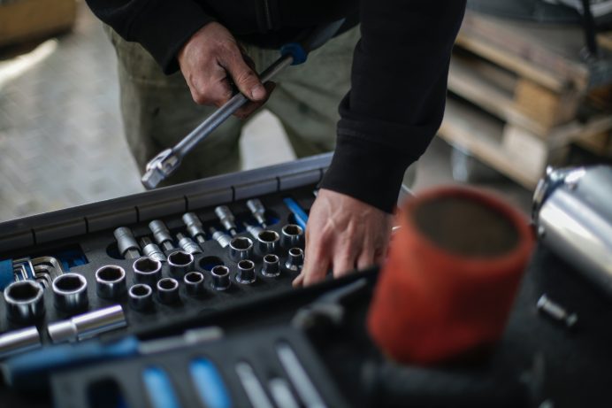auto technician using tools