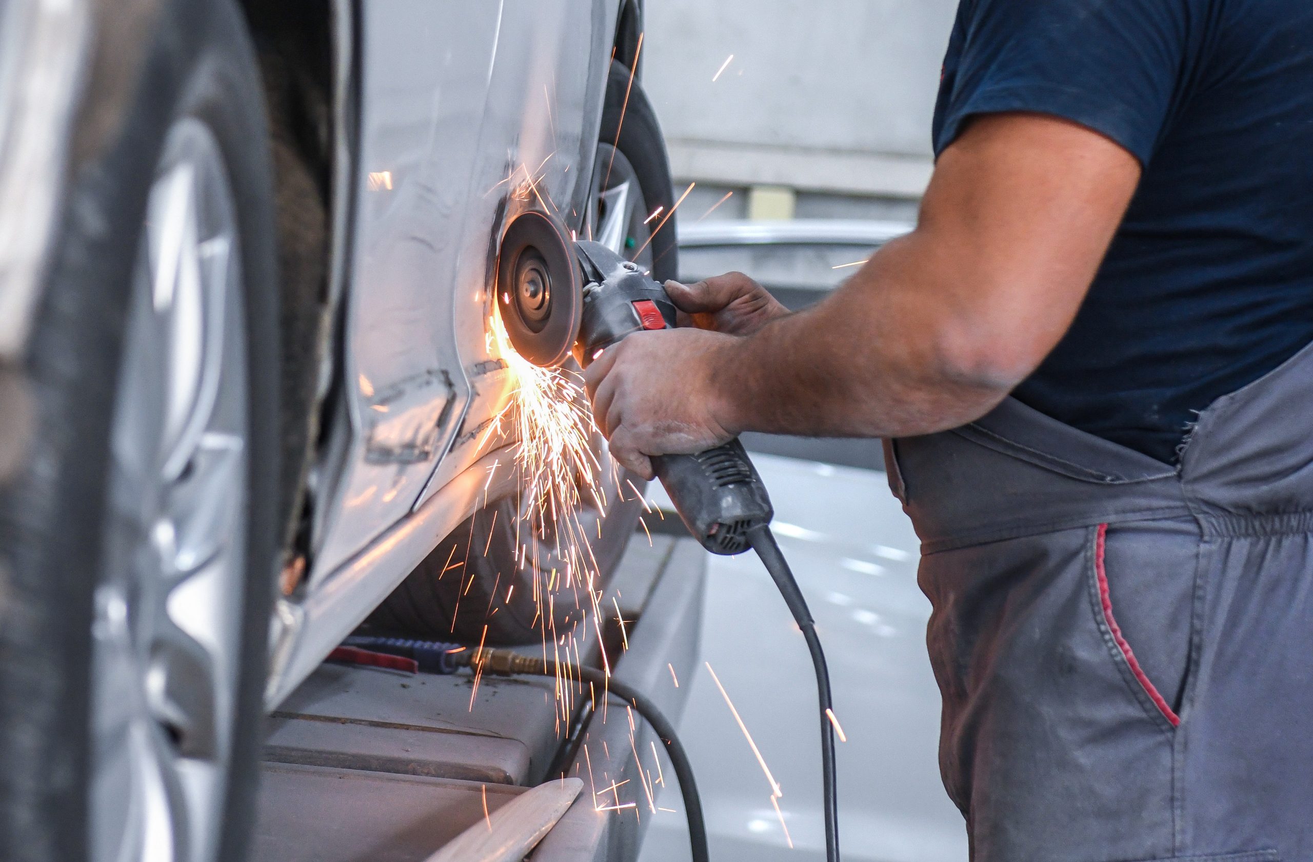 technician fixing a car