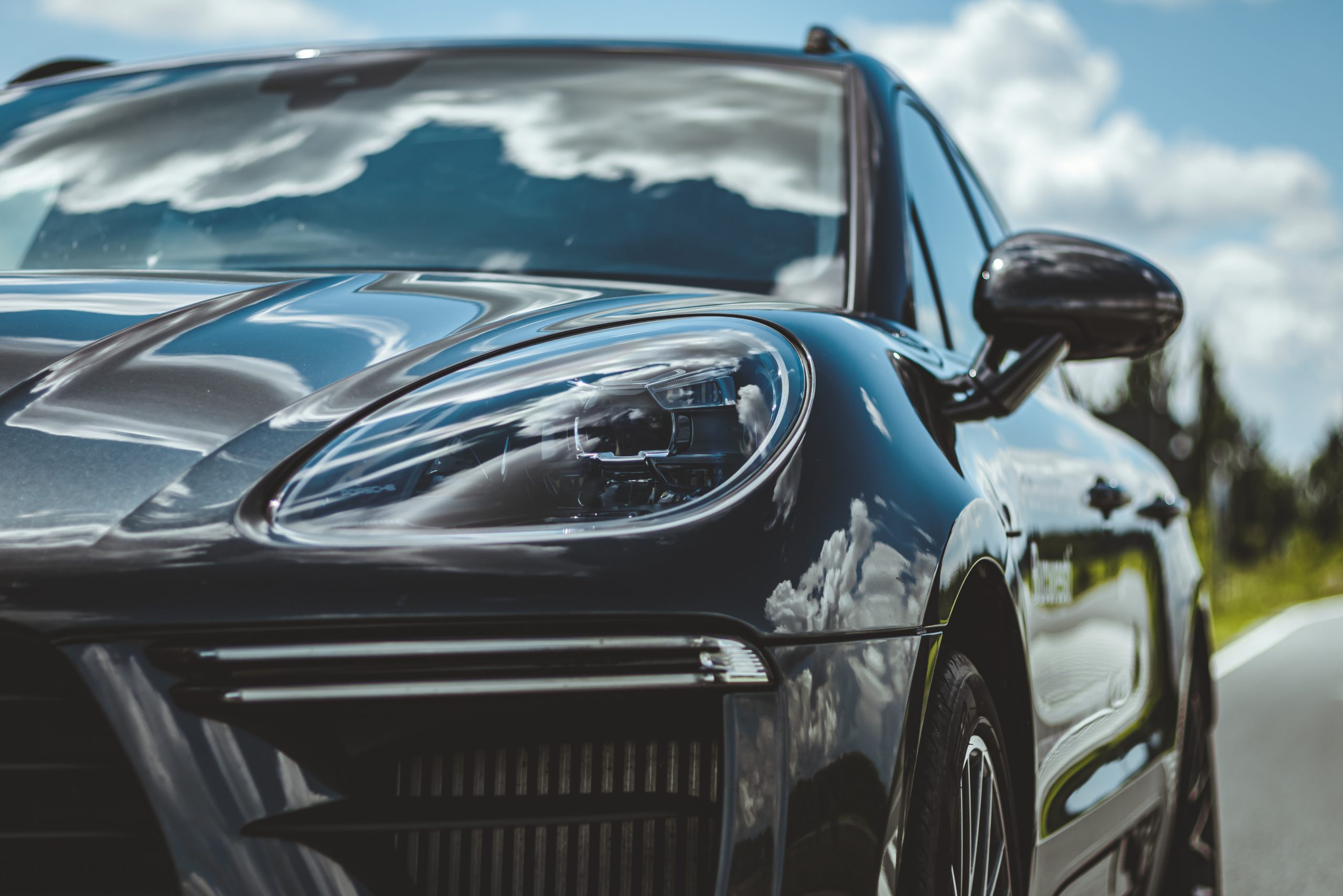 shiny black porsche cayenne headlights