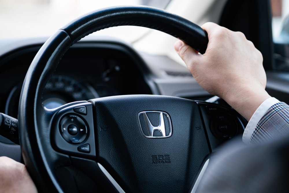 Bangkok,,Thailand20,March,2021,,Man,Hand,Holding,Steering,Wheel,And person driving a honda